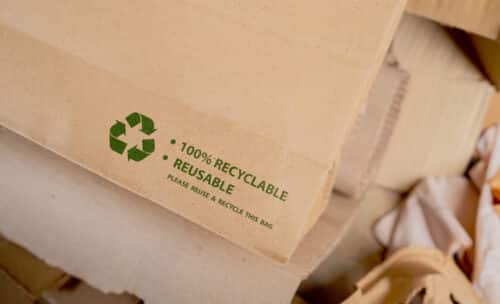 brown paper bag that is 100 recyclable reusable with green recycling symbol ecofriendly save world concept