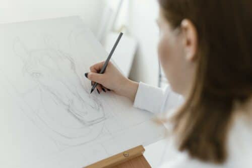 young woman drawing canvas